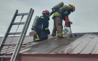 Structure Fire Newport WA 9-30-2023 - Firefighters on Roof