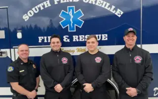 SPOFR Chief Dan Williams, left, Jake, Titus and Don are pictured in front of a new SPOFR ambulance