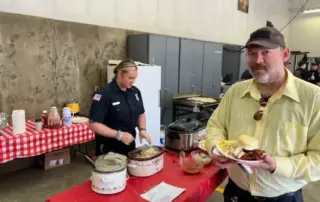 2024 Pancake Feed Fundraiser - man with plate full of food