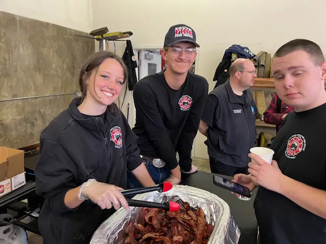 2024 Pancake Feed Fundraiser - serving bacon with a smile