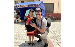 8 -year old Raizele with Chief Stocking